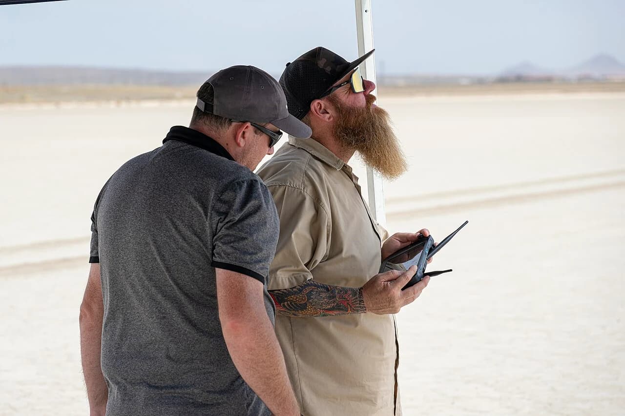 NASA remote pilots using handheld controls during a drone test